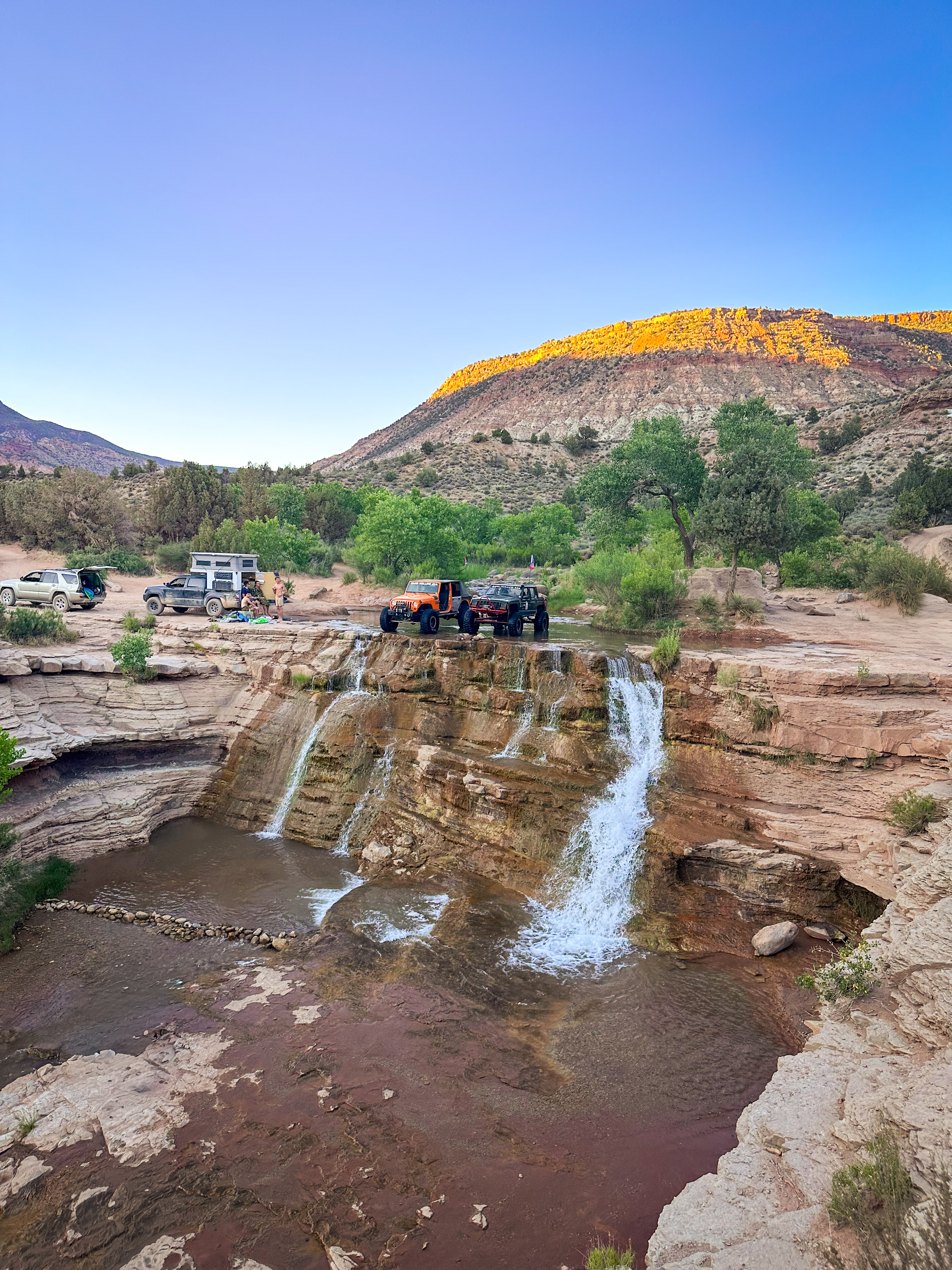 Jeep on Toquerville Falls trail with waterfall visible