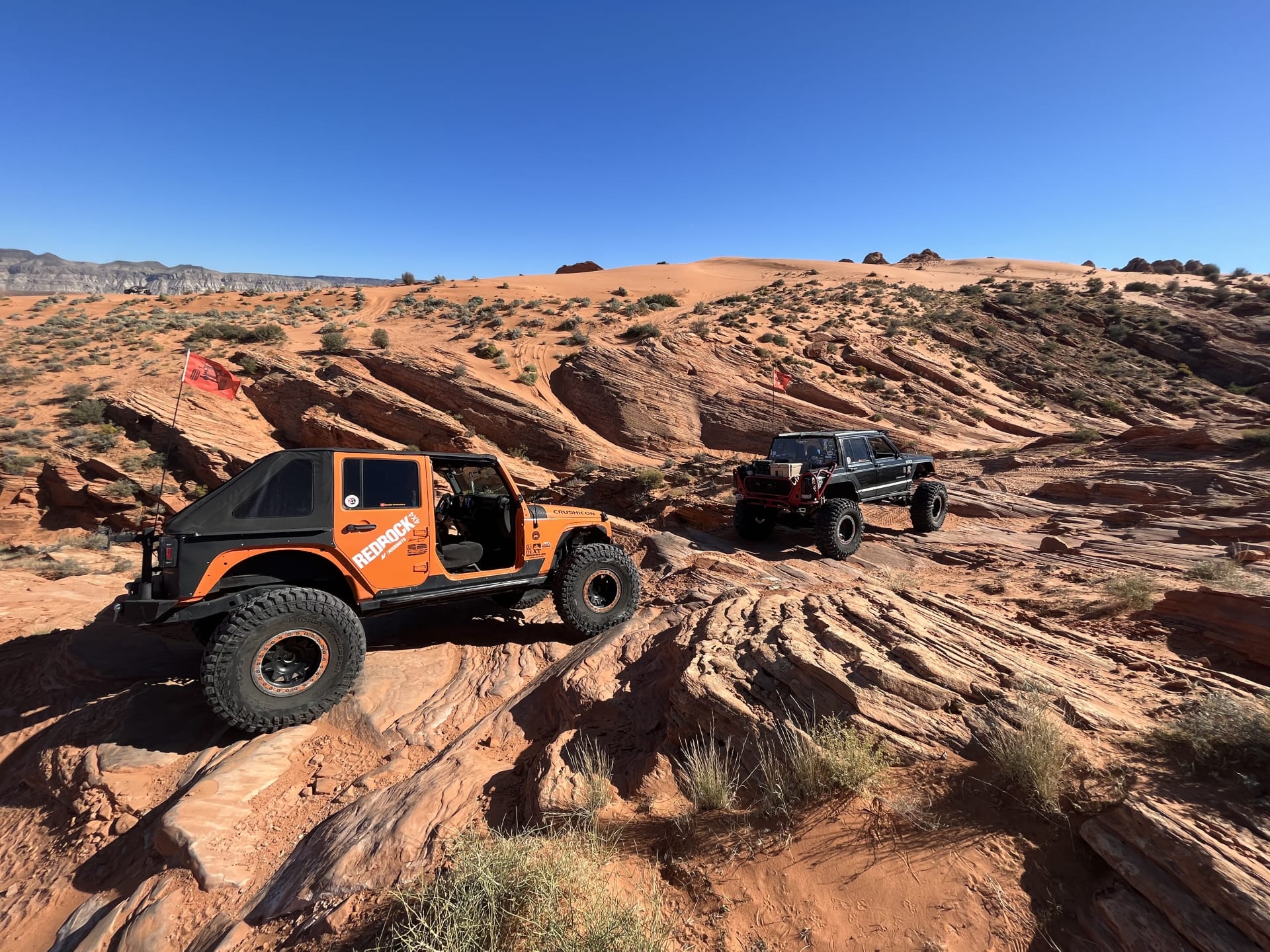 Sand Hollow 4x4 Jeeps lined up on trail